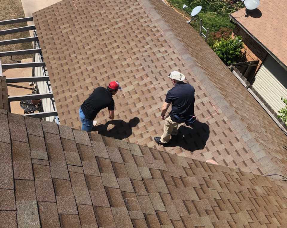 Two men on a roof