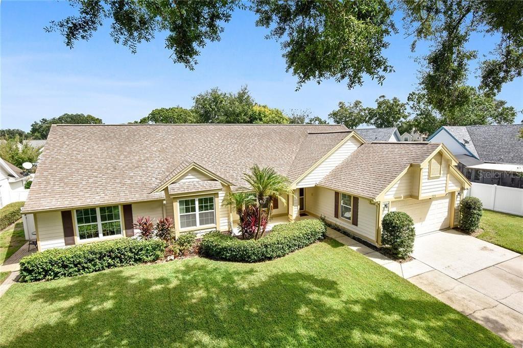 Yellow house with lawn