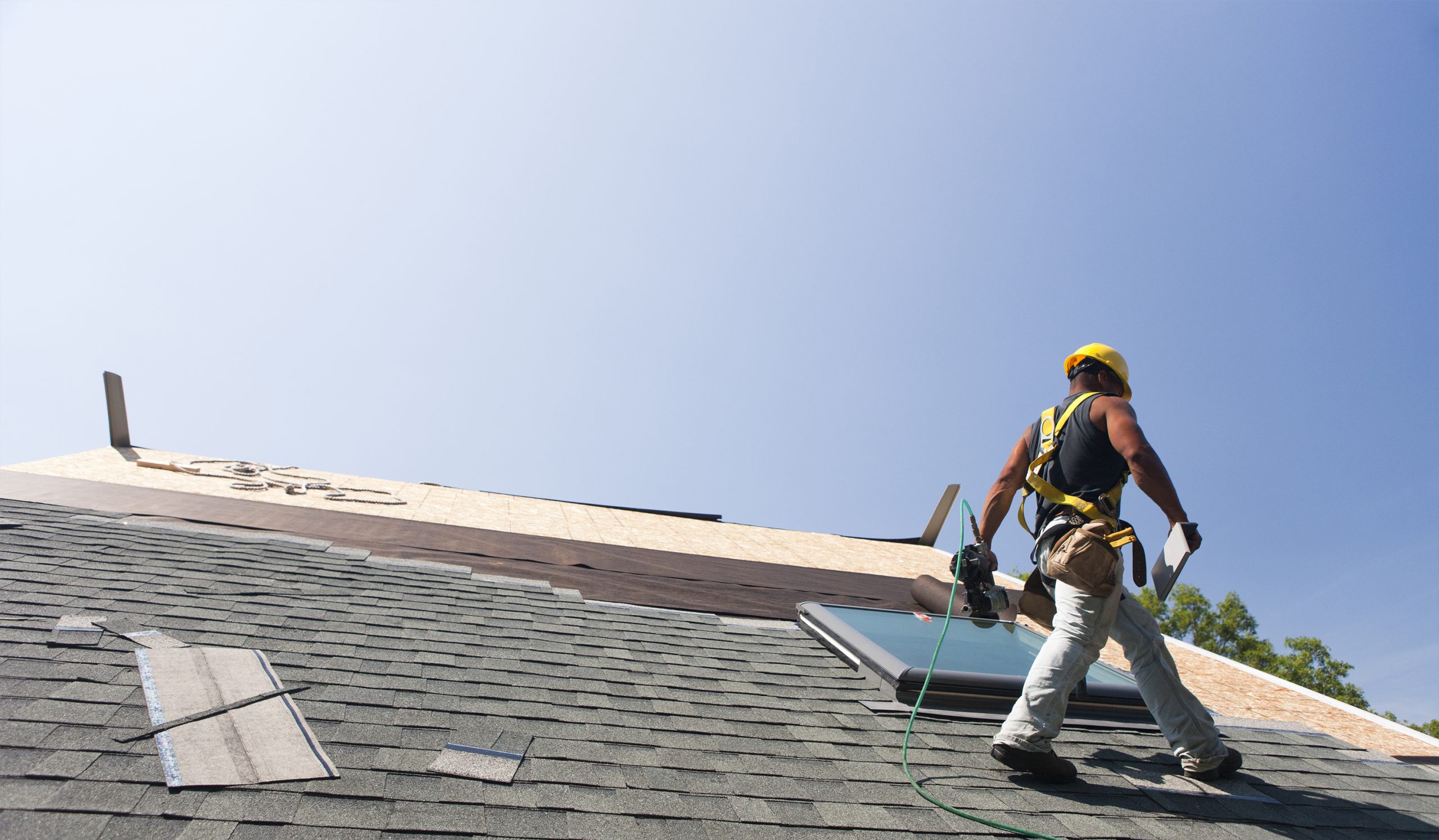 Roofer working on house